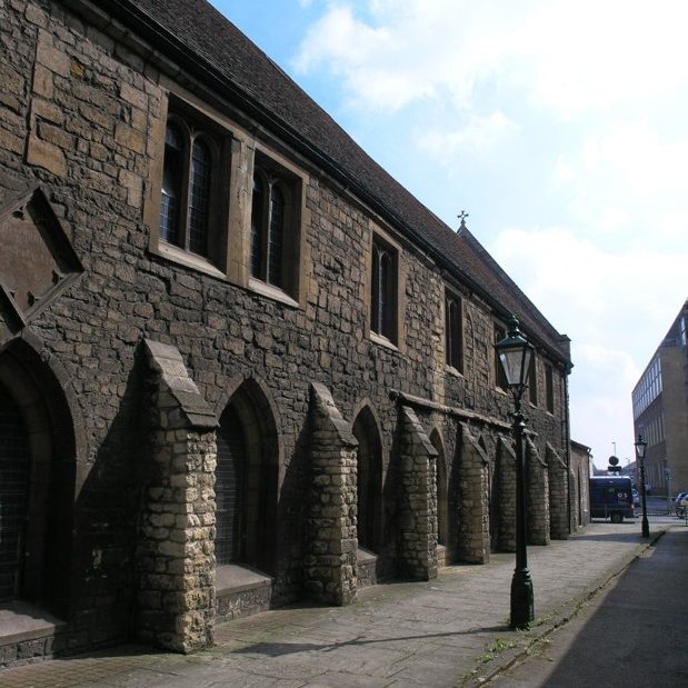 Exterior view of Greyfriars building showing buttresses and windows.