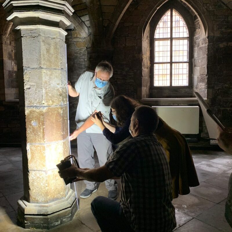 Photo of volunteers cleaning graffiti inside Greyfriars